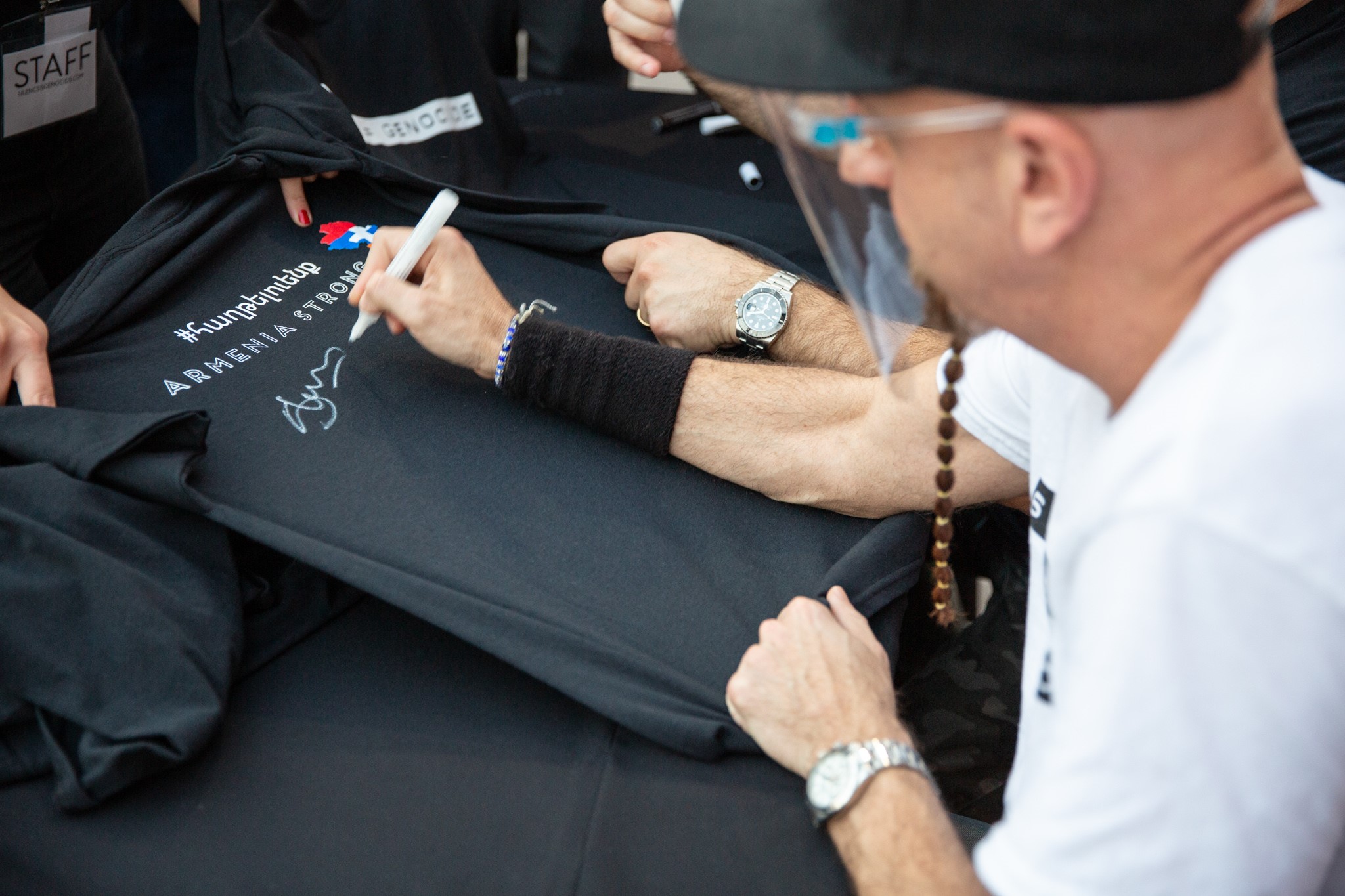 Silence Equals Genocide - SOAD members John Dolmayan and Shavo Odadjian Sign Tees for Charity